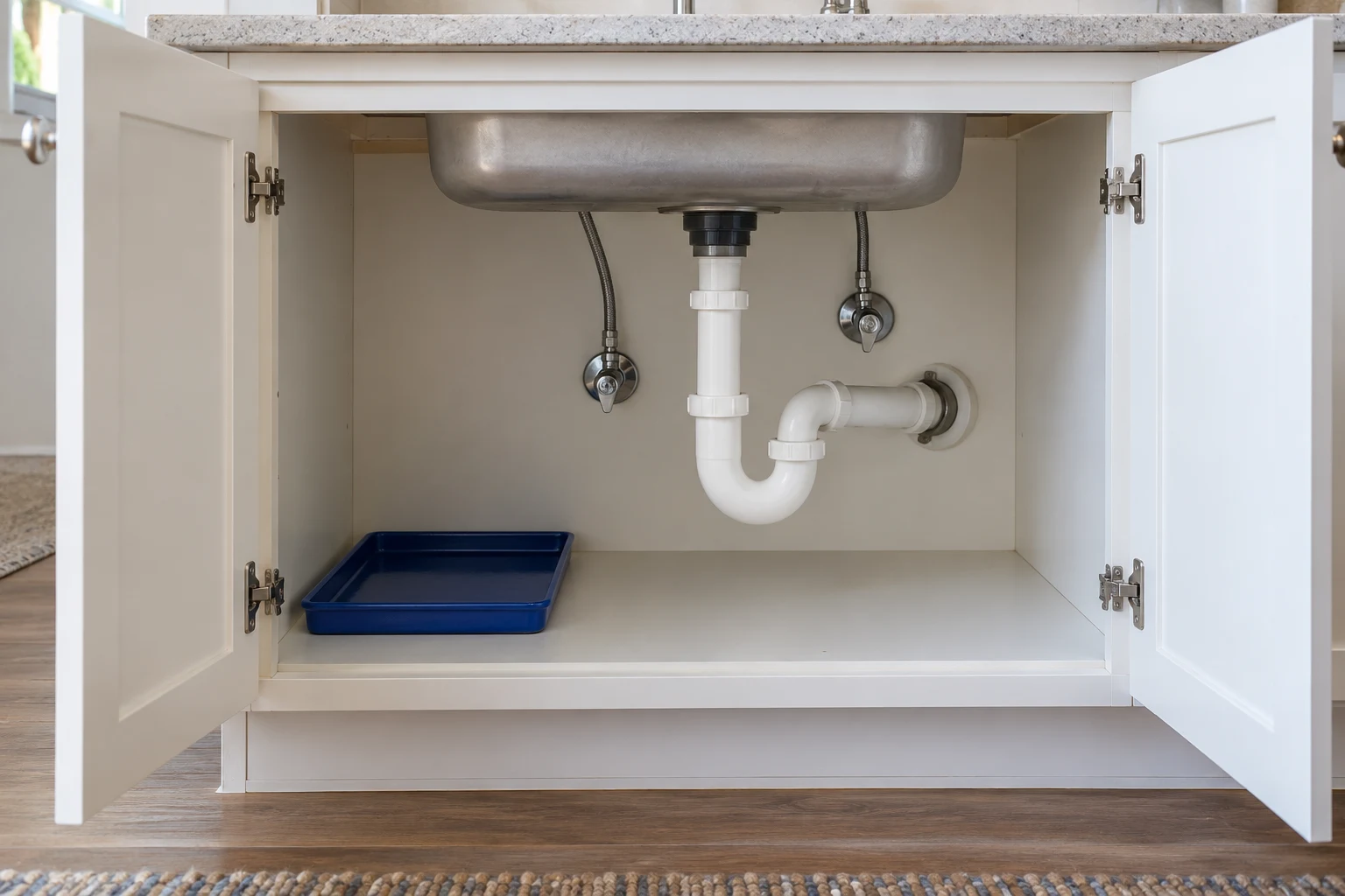 AI concept of under-sink organization around visible plumbing